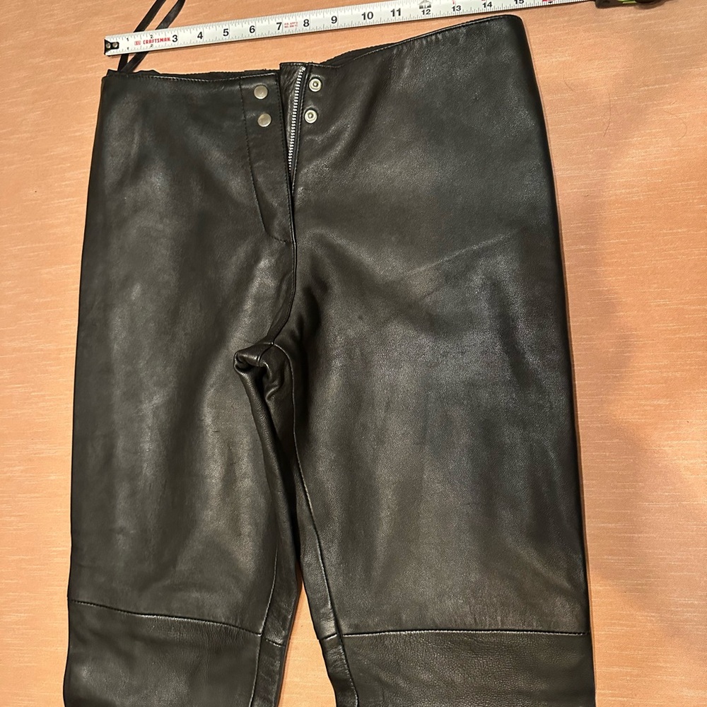 Women’s leather motorcycle pants. “Just Us” is the brand.
